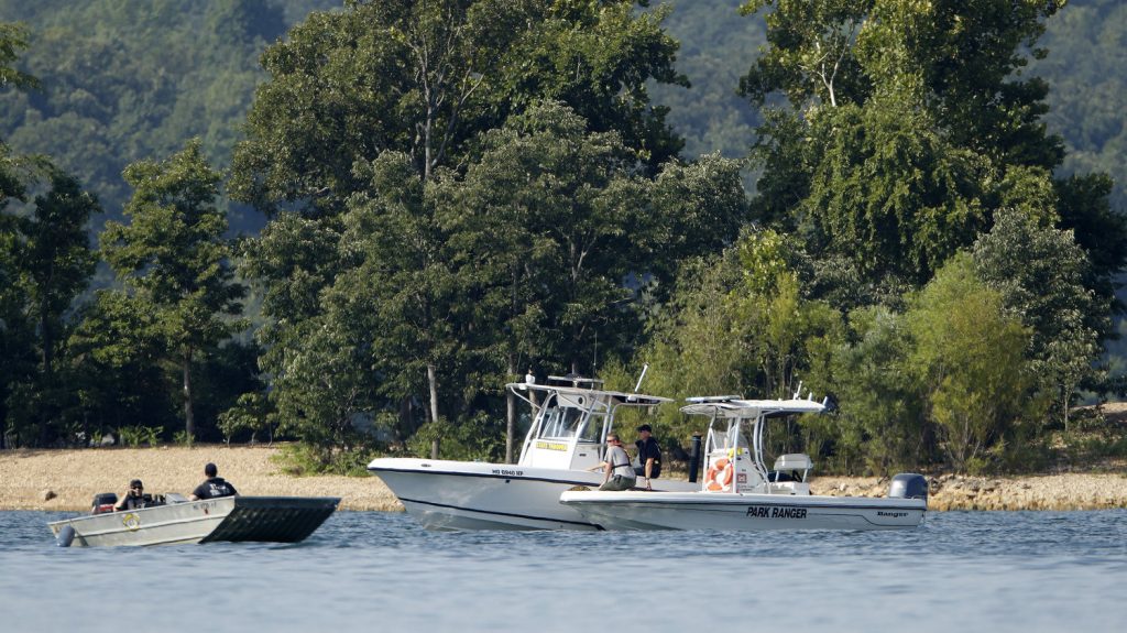 ap_18201543335200_wide-82bb012ab2eca92b8bd812e3d3dc82e04842d7a0-s1500-c85 Emergency workers patrol an area of Table Rock Lake in Branson, Mo., on Friday, a day after a duck boat capsized and sank during a storm. Authorities say 17 people died in the accident. (Charlie Riedel/AP)