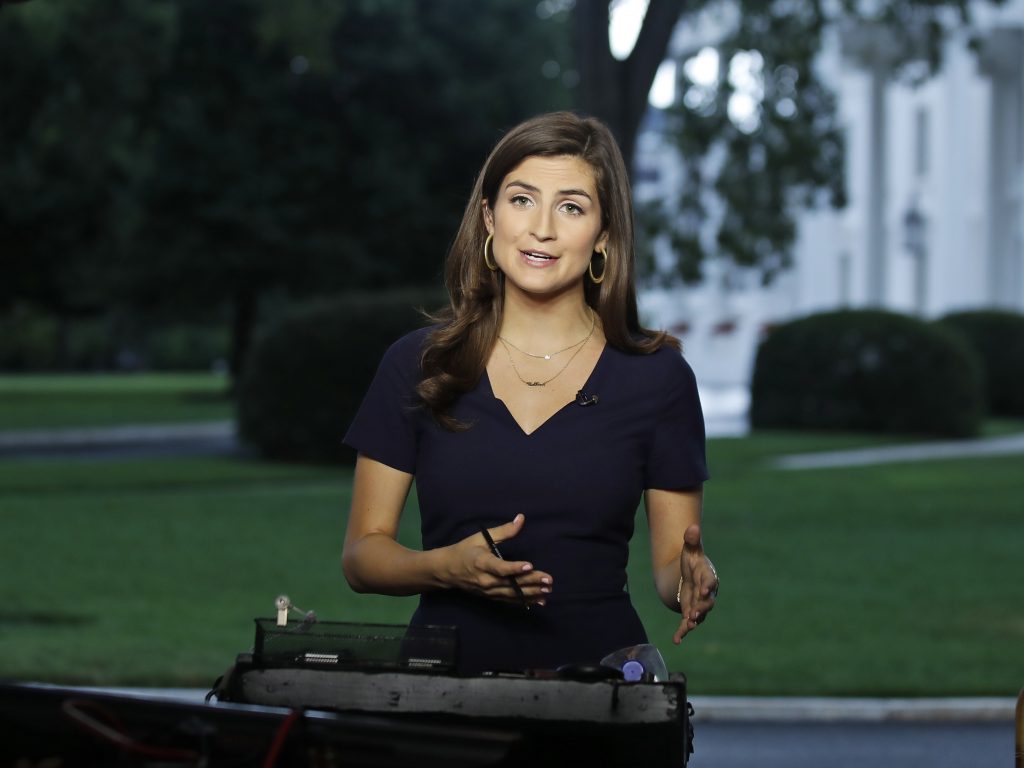 CNN White House correspondent Kaitlan Collins talks during a live shot in front of the White House on Wednesday. Collins says the White House denied her access to an open press event because officials found her earlier questions to the president 