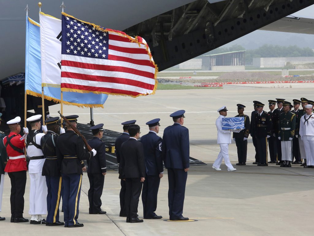 A U.N. honor guard carries a box containing remains believed to be from American servicemen killed during the 1950-53 Korean War after arriving from North Korea, at Osan Air Base in Pyeongtaek, South Korea on Friday. A U.N. honor guard carries a box containing remains believed to be from American servicemen killed during the 1950-53 Korean War after arriving from North Korea, at Osan Air Base in Pyeongtaek, South Korea on Friday. (Ahn Young-joon/AP)