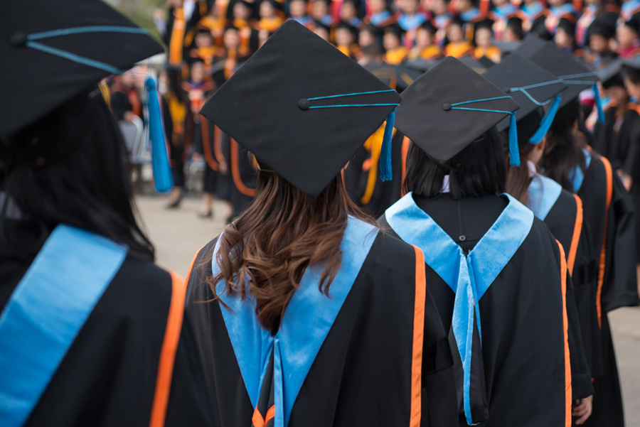 Graduates wear graduation gowns,Ceremonies of university graduates. (Big Stock image)