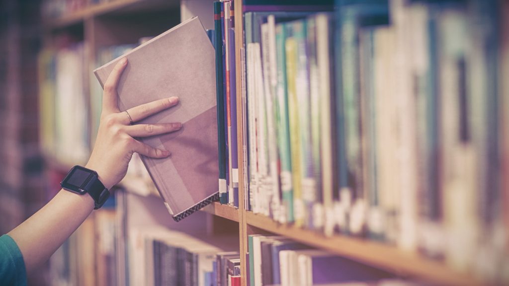 college16x9 Student picking book from bookshelf at university (bigstockphoto.com)