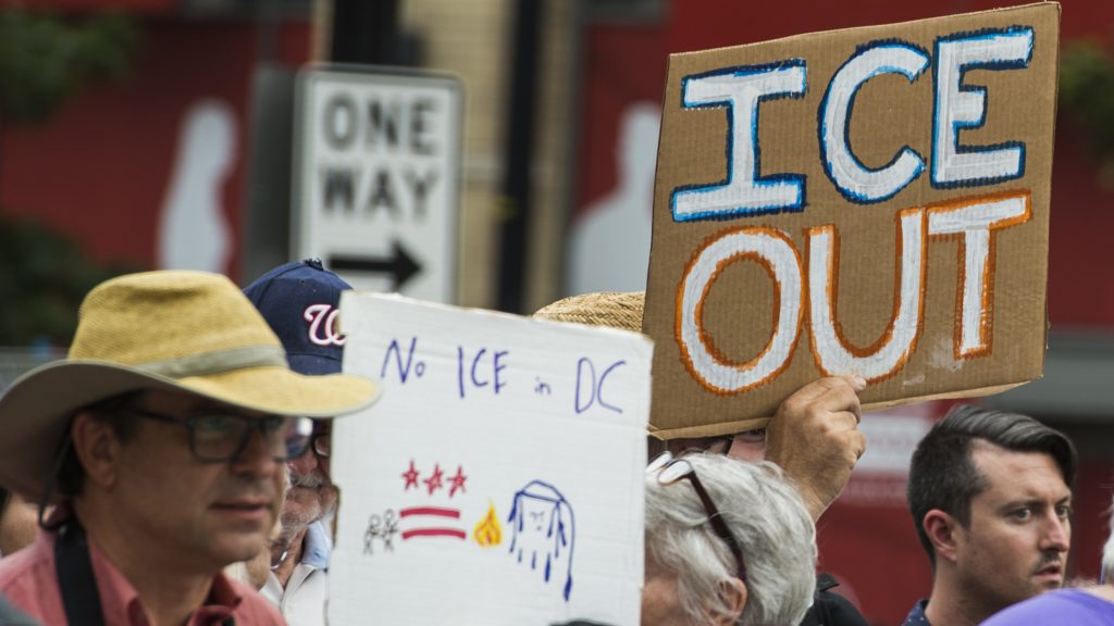 People hold up signs July 16 in Washington, D.C., as they protest ICE. Getting rid of the agency has become a popular rallying cry among progressives, but the House on Wednesday overwhelmingly passed a symbolic measure voicing support for ICE. People hold up signs July 16 in Washington, D.C., as they protest ICE. Getting rid of the agency has become a popular rallying cry among progressives, but the House on Wednesday overwhelmingly passed a symbolic measure voicing support for ICE. (Andrew Caballero-Reynolds/AFP/Getty Images)
