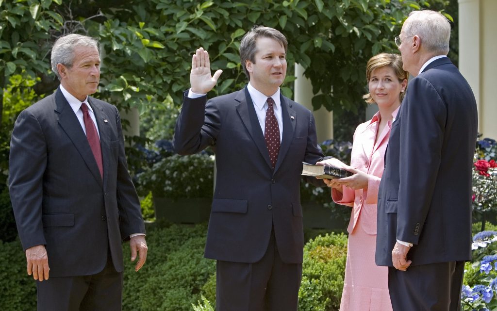 Brett Kavanaugh is sworn in as a federal judge by Supreme Court Justice Anthony Kennedy in 2006. President George W. Bush looks on. Kavanaugh is Trump’s pick to replace Kennedy on the Supreme Court. Brett Kavanaugh is sworn in as a federal judge by Supreme Court Justice Anthony Kennedy in 2006. President George W. Bush looks on. Kavanaugh is Trump's pick to replace Kennedy on the Supreme Court.
