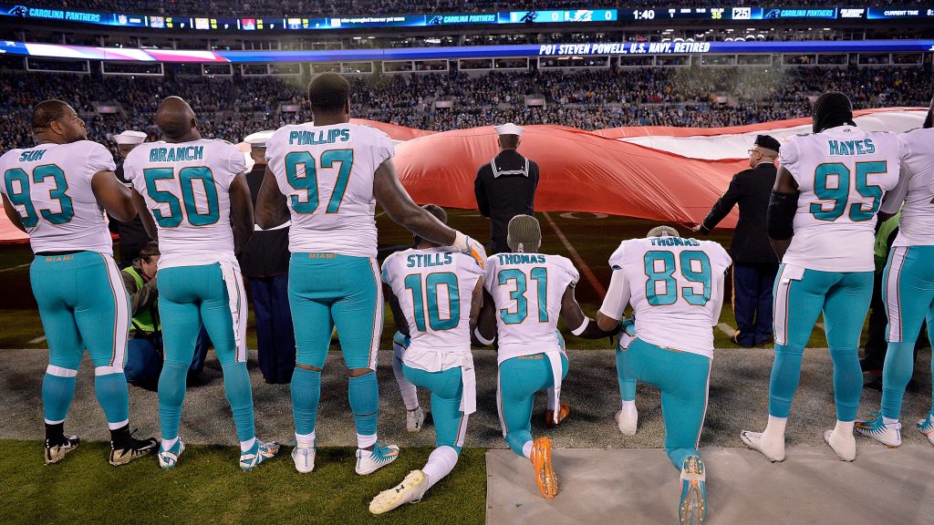 Miami Dolphins players kneel during the national anthem before their game against the Carolina Panthers at Bank of America Stadium on Nov. 13, 2017, in Charlotte, N.C. Miami Dolphins players kneel during the national anthem before their game against the Carolina Panthers at Bank of America Stadium on Nov. 13, 2017, in Charlotte, N.C. (Grant Halverson/Getty Images)