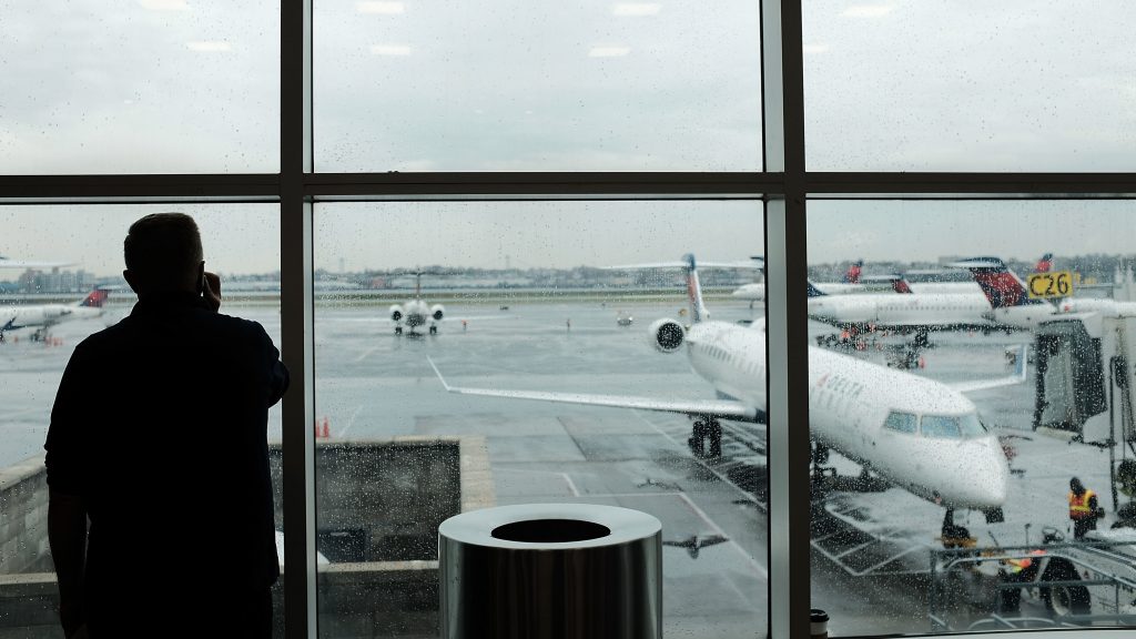 A passenger looks over planes sitting on the tarmac at LaGuardia Airport in New York City on Nov. 22. A previously undisclosed TSA program flags passengers for observation, and undercover air marshals observe their behavior — including whether they make calls or send texts as they travel, The Boston Globe reports. A passenger looks over planes sitting on the tarmac at LaGuardia Airport in New York City on Nov. 22. A previously undisclosed TSA program flags passengers for observation, and undercover air marshals observe their behavior — including whether they make calls or send texts as they travel, The Boston Globe reports. (Spencer Platt/Getty Images)