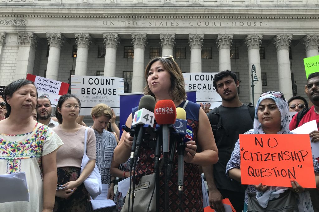Rep. Grace Meng, D-N.Y. (center) held a press conference earlier this month outside Manhattan federal court with Liz OuYang (left) of the New York Immigration Coalition and other critics of the new citizenship question on the 2020 census. Rep. Grace Meng, D-N.Y. (center) held a press conference earlier this month outside Manhattan federal court with Liz OuYang (left) of the New York Immigration Coalition and other critics of the new citizenship question on the 2020 census. (Hansi Lo Wang/NPR)