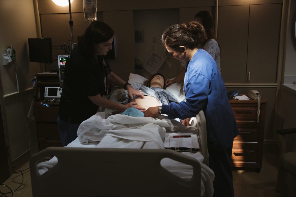 Using a mannequin to simulate dangerous scenarios, a team at Pomona Valley Hospital Medical Center learns standard treatments for obstetric emergencies like hemorrhage. Using a mannequin to simulate dangerous scenarios, a team at Pomona Valley Hospital Medical Center learns standard treatments for obstetric emergencies like hemorrhage. (Bethany Mollenkof for NPR)