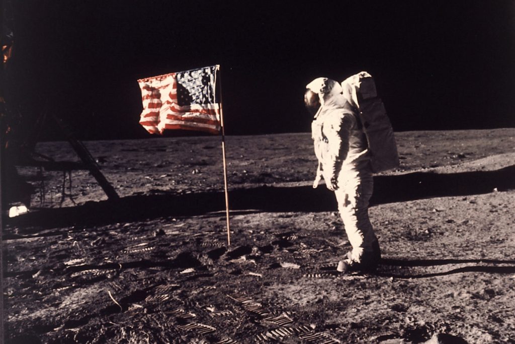 APOLLO 11 MOON LANDING SPACE EXPLORATION, APOLLO 11 MISSION, FIRST MAN TO LAND ON MOON, WALK ON MOON, AMERICAN ASTRONAUT WITH U.S. FLAG, SPACE SUIT, LUNAR SURFACE, FOOTPRINTS, CENTURY SHOWCASE