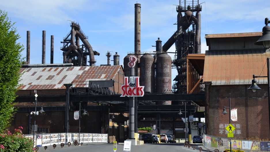steel_stacks_crop A new “SteelStacks” sign adorns the old Bethlehem Steel Corp. blast furnaces. Behind the sign is a sparkling new complex with restaurants, a movie theatre and a large concert venue. (Jason Margolis/PRI)