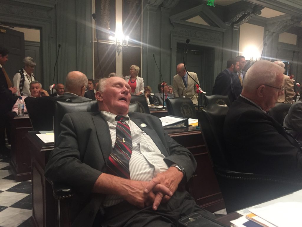 wilson State Rep. Dave Wilson takes an understandable snooze about 7 a.m. on July 1 during a recess in this year's final legislative session. (Cris Barrish/WHYY)