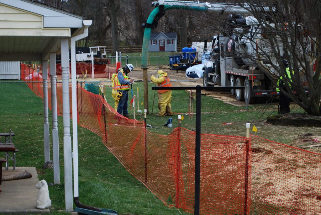 2018-04-02-16.34.20-1920×1285 In this file photo from May, pipeline workers probe the ground on Lisa Drive in West Whiteland Township where sinkholes have developed as a result of the Mariner East 2 construction. (Jon Hurdle/StateImpact Pennsylvania)