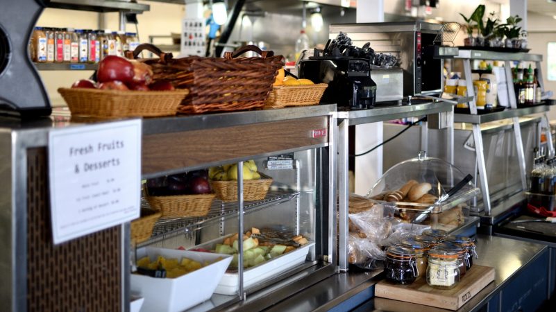 Chefs in a kitchen made of five combined trailers, located on parking lot behind the Greater Philadelphia Expo Center in Oaks, Pa., prepare 400 meals a day. (Bastiaan Slabbers for WHYY)