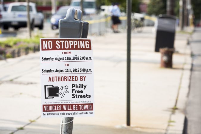 A sign on a parking meter advertises that there will be no stopping in honor of the Philly Free Streets event which closed down Broad Street to cars from City Hall to Germantown Avenue on August 11, 2018. (Rachel Wisniewski for WHYY)