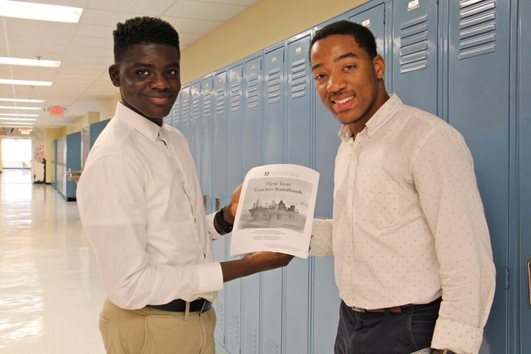 Science Leadership Academy students Khalid Abogourin (left), 17, and Horace Ryan III, 16, created a handbook for first year teachers that is being used in teacher orientations throughout the school district.