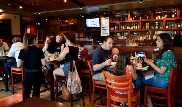 Families have lunch at the Iron Hill Brewery, in Phoenixville, PA, on August 21, 2018. (Bastiaan Slabbers for WHYY)