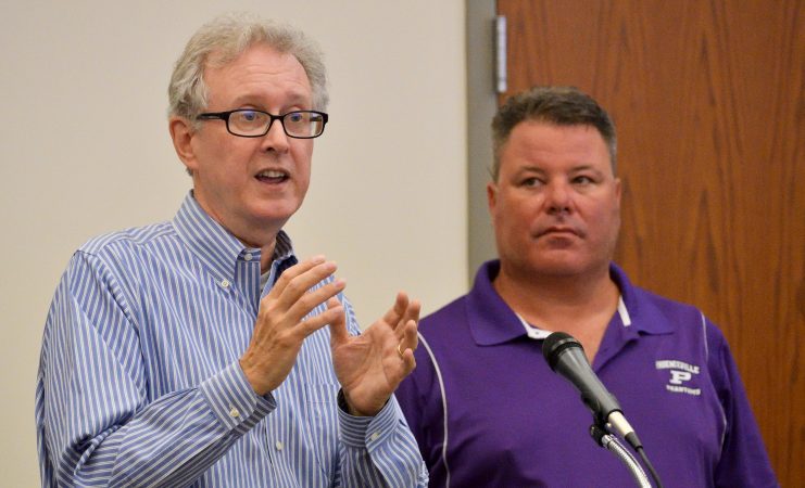 Consultant Thomas Frawley and developer Manny DeMutis present plans for the extension of rail commuter service from Philadelphia to Phoenixville, at a borough meeting in Phoenixville, PA, on August 21, 2018. (Bastiaan Slabbers for WHYY)