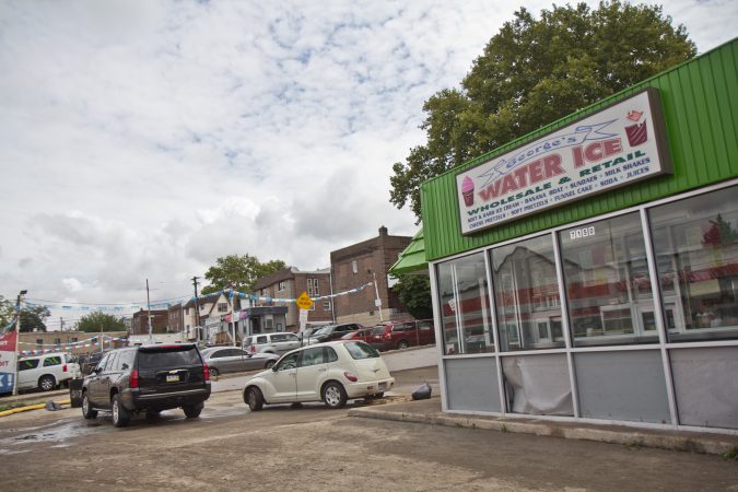 Cars in the parking lot of George’s Water Ice in Upper Darby were carried there by flood waters around 10 a.m. Monday. (Kimberly Paynter/WHYY)