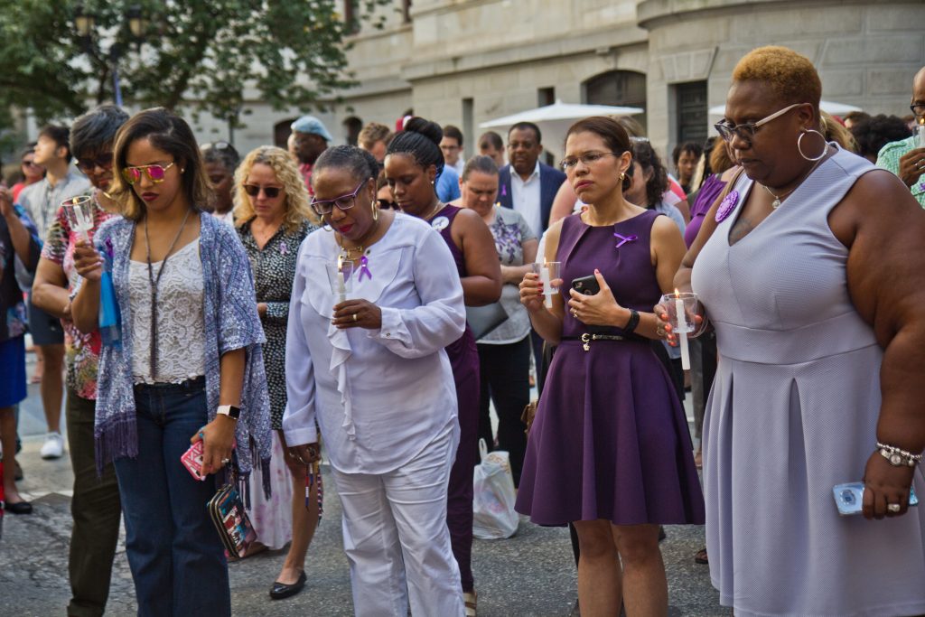 Colleagues, friends, and family of Linda Rios remember her at a candlelight vigil at City Hall courtyard Thursday afternoon. (Kimberly Paynter/WHYY)