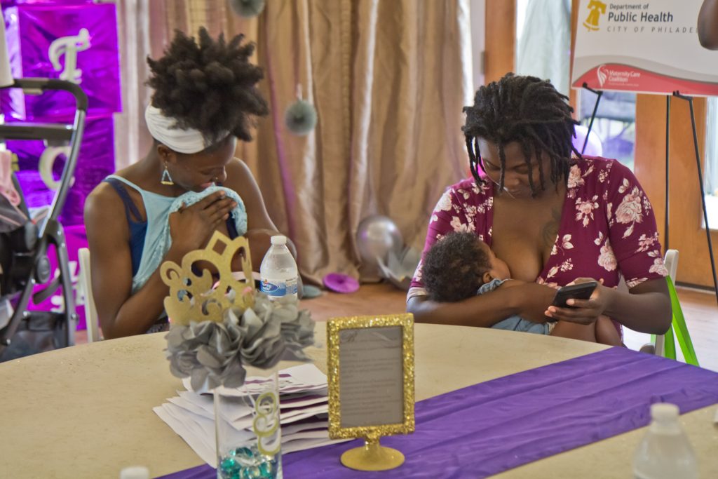 2018 8 3 k paynter big latch breastfeeding-5 Moms Caylon Fowlkes, with Arielle, 4 months, (left) and Charmer Nelson, and Azaiah, 4 months, participate in the Big Latch event in Philadelphia. (Kimberly Paynter/WHYY)