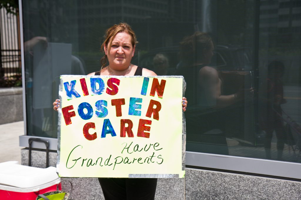 2018 8 3 k paynter dhs family court protest-4 Virginia McKale protests outside Family Court Friday. She’s been separated from her grandchildren since October. (Kimberly Paynter/WHYY)