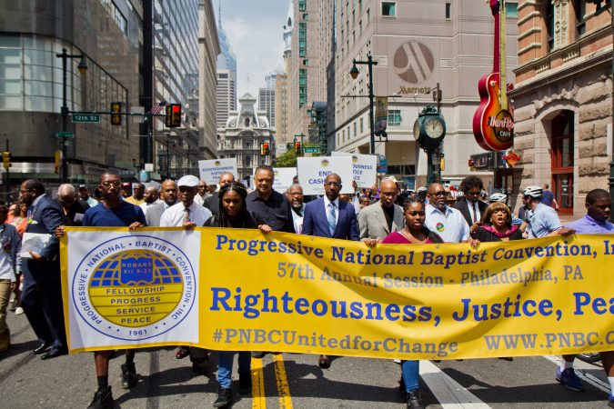 Members of the Progressive National Baptist Convention march for justice on Market Street in Philadelphia. (Kimberly Paynter/WHYY)