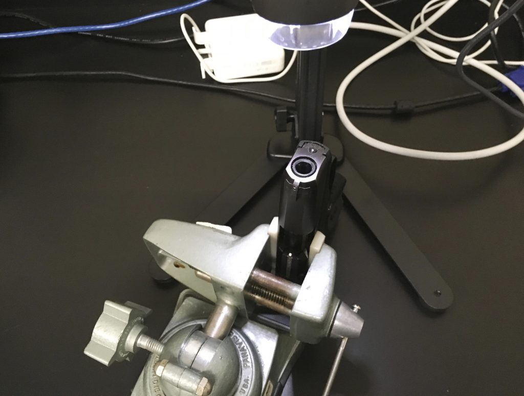 Gun Testing Lab In this May 25, 2017 photo, a handgun is shown under a camera at the New Jersey state police forensics lab in Hamilton, N.J. Technicians study the inside of weapons to look for blood, body tissue and fibers after shootings.(AP Photo/Josh Cornfield)