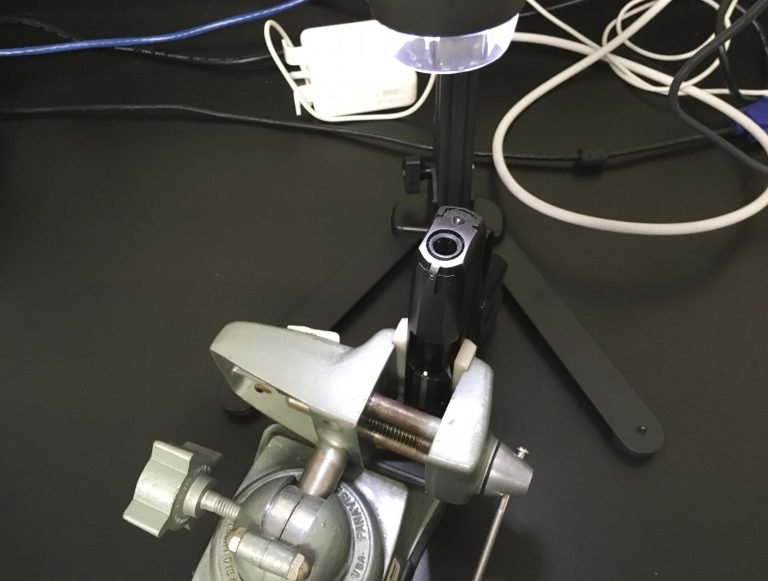In this May 25, 2017 photo, a handgun is shown under a camera at the New Jersey state police forensics lab in Hamilton, N.J. Technicians study the inside of weapons to look for blood, body tissue and fibers after shootings.(AP Photo/Josh Cornfield)