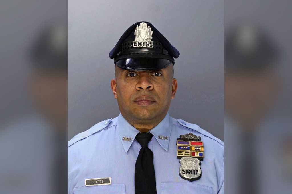 AP_18218626226243-2 This undated photo provided by the Philadelphia Police Department shows police officer Jaison Potts, who was shot in the face Monday, Aug. 6, 2018, while helping fellow SWAT officers serve a warrant at a house in Philadelphia. A man who authorities say shot at the officers was critically wounded in the shootout early Monday. A woman at the home was also wounded. Officials say the person named in the warrant was not in the residence and remains at large. (Philadelphia Police Department via AP)