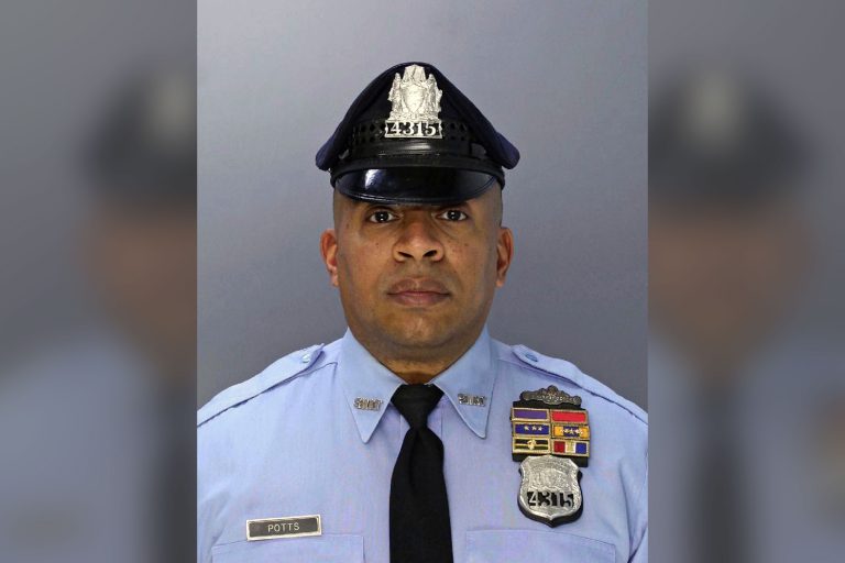 This undated photo provided by the Philadelphia Police Department shows police officer Jaison Potts, who was shot in the face Monday, Aug. 6, 2018, while helping fellow SWAT officers serve a warrant at a house in Philadelphia. A man who authorities say shot at the officers was critically wounded in the shootout early Monday. A woman at the home was also wounded. Officials say the person named in the warrant was not in the residence and remains at large. (Philadelphia Police Department via AP)