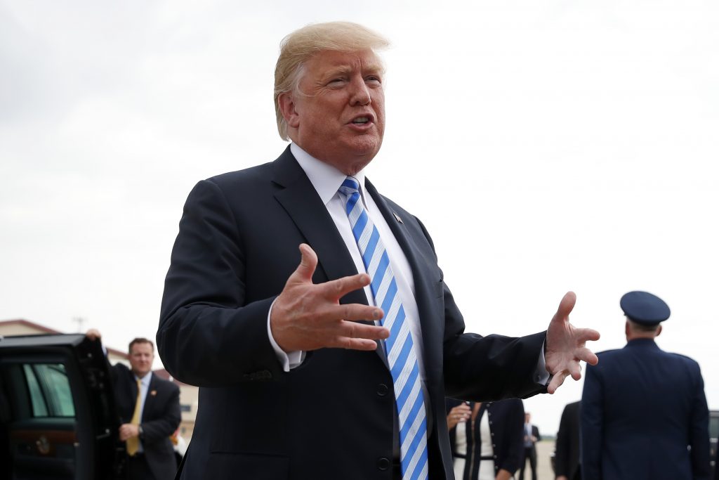 Donald Trump President Donald Trump speaks to the media after he steps off Air Force One, Tuesday, Aug. 21, 2018, in Charleston, W.Va. Trump says the conviction of his former campaign chairman Paul Manafort on financial crimes is