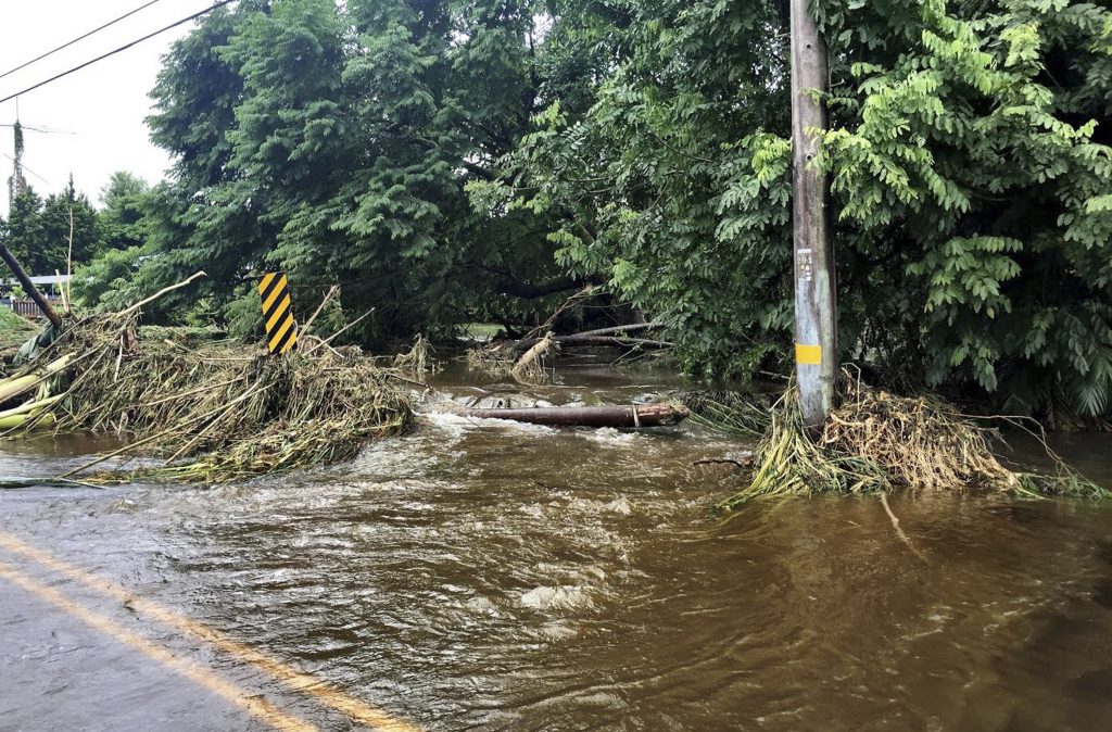 Damage from from Hurricane Lane Friday, Aug. 24, 2018, near Hilo, Hawaii. Hurricane Lane barreled toward Hawaii on Friday, dumping torrential rains that inundated the Big Island's main city as people elsewhere stocked up on supplies and piled sandbags to shield oceanfront businesses against the increasingly violent surf. (Jessica Henricks via AP)
