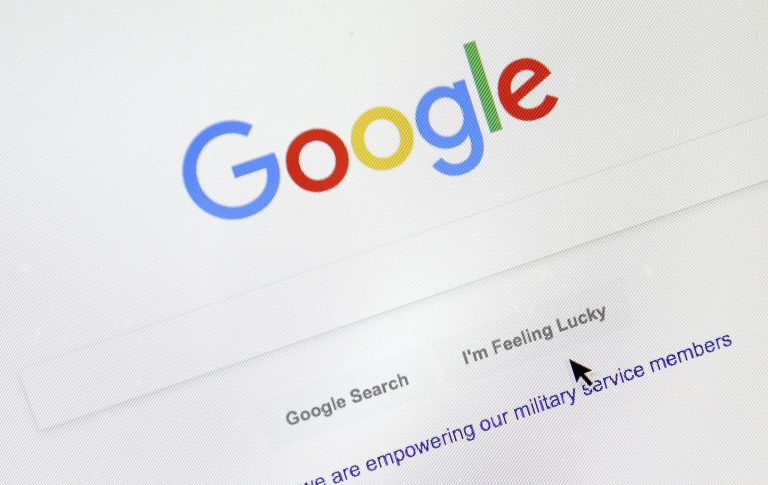 A cursor moves over Google's search engine page on Tuesday, Aug. 28, 2018, in Portland, Ore. (Don Ryan/AP Photo)