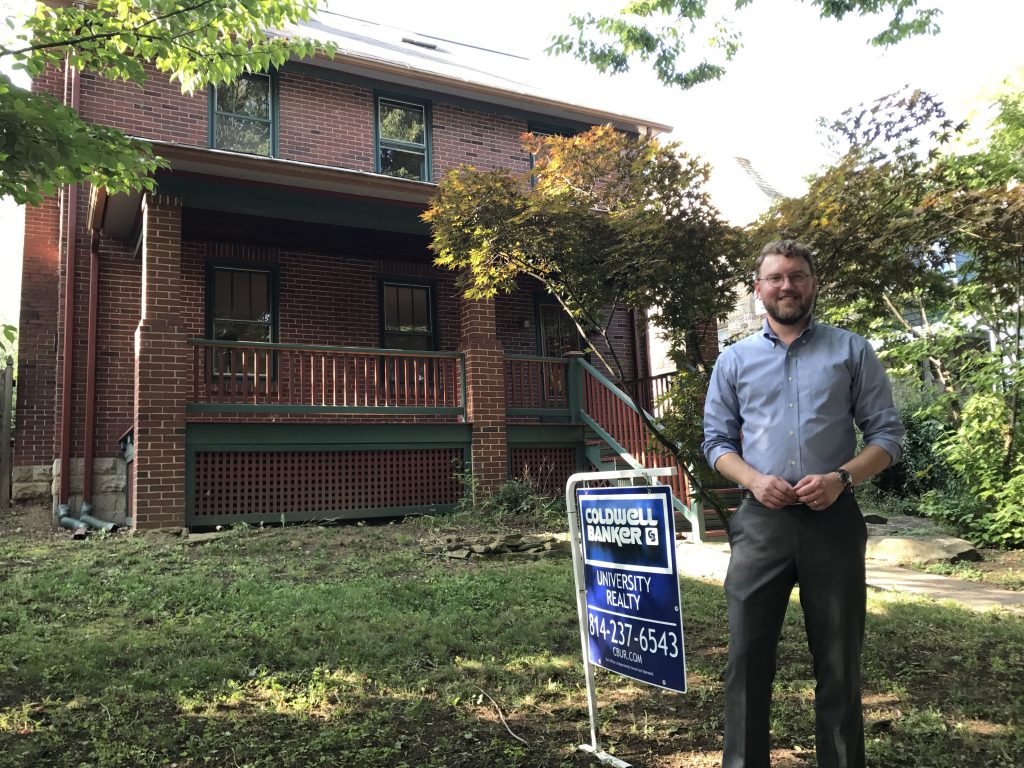 IMG_5060 State College borough planning director Ed LeClear in front of one of the houses sold through the Neighborhood Sustainability Program.
(EMILY REDDY / WPSU)
