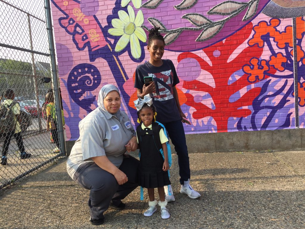 IMG_8548 Quimayah Gibson-McClendon prepares for her first day of kindergarten at William Dick School in North Philadelphia with her great-aunt Elesha Sears (left), and grandmother Tashawn McClendon, (Avi Wolfman-Arent/WHYY)