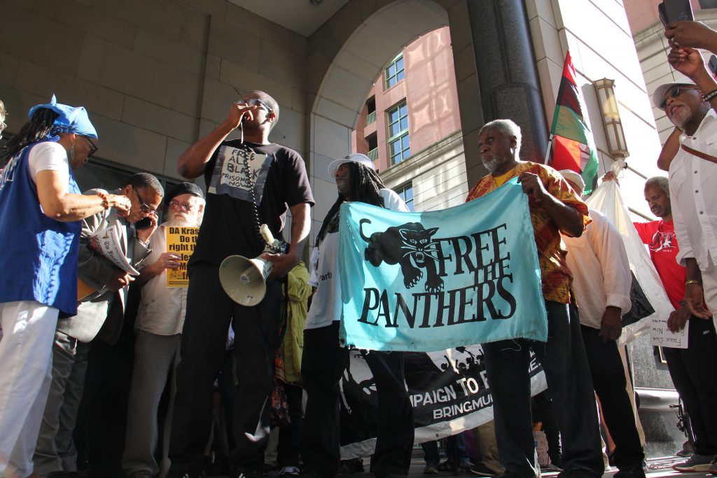 Image uploaded from iOS Supporters of Mumia Abu-Jamal, convicted in the 1981 murder of a Philadelphia police officer, gather Thursday outside the Criminal Justice Center where a judge was considering whether Abu-Jamal’s appeals should be reinstated. (Emma Lee/WHYY)