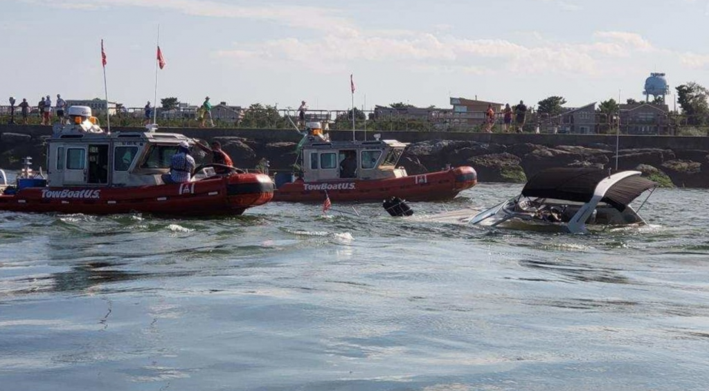 Screen Shot 2018-08-31 at 10.31.06 AM Commercial salvage crews arrive at the scene of a partially sunken boat in the Barnegat Inlet Thursday. (USCG image)