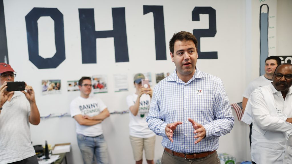 Democrat Danny O’Connor, the Franklin County recorder, center, speaks to volunteers and supporters at his campaign headquarters on Tuesday.