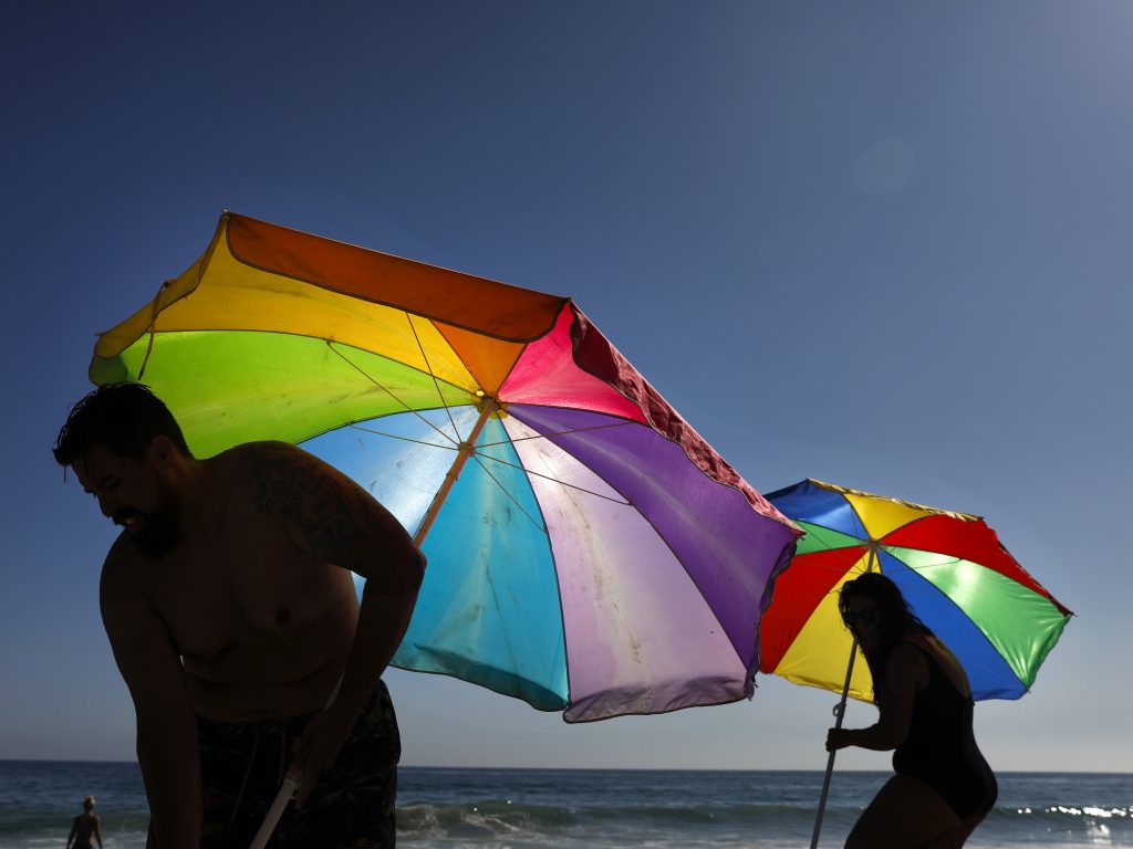 Mario Ramos (left) and wife Tally adjust their umbrellas in Laguna Beach, Calif. The state was among a number of places this summer that experienced their highest temperatures on record. Mario Ramos (left) and wife Tally adjust their umbrellas in Laguna Beach, Calif. The state was among a number of places this summer that experienced their highest temperatures on record. (Jae C. Hong/AP)