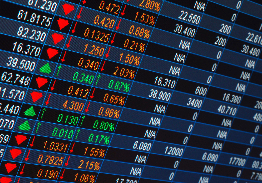 stock market quotes from a computer screen Numbers are shown on a stock market board.