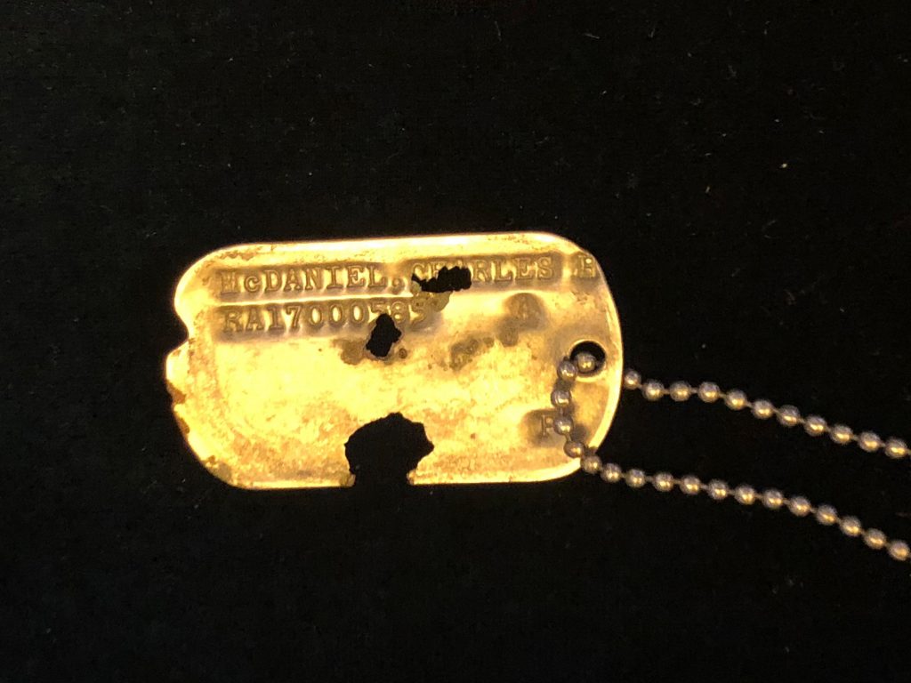 The single dog tag in the 55 boxes of human remains turned over to the U.S. by North Korea last week was still readable. It was presented to Master Sgt. Charles Hobert McDaniel's two sons at a ceremony on Wednesday.
(Jay Price /Member station WUNC)