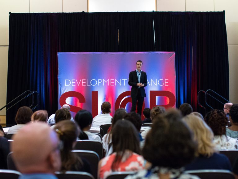 Bryn Sobott of the FREO2 Foundation presents his group's solution to pneumonia treatment — an oxygen delivery machine that can operate using the energy generated by running water — at a pitch competition organized by Saving Lives At Birth: A Grand Challenge for Development in Washington, D.C. (Pearl Mak/NPR)