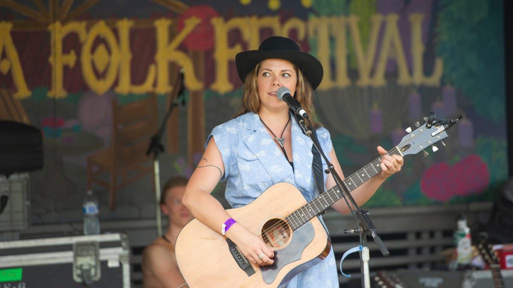 folk6 Toronto-based singer Melanie Brulée performs for the crowd gathered at the Tank Stage. (Jonathan Wilson for WHYY)