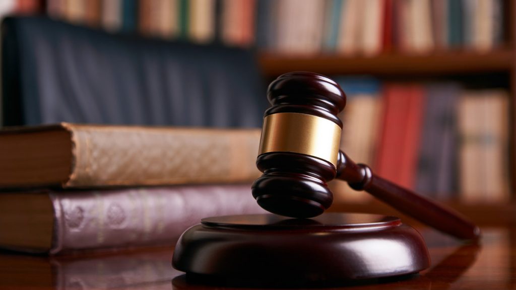 gavel16x9 Judge's gavel on wooden table with law books. (bigstockphoto.com)