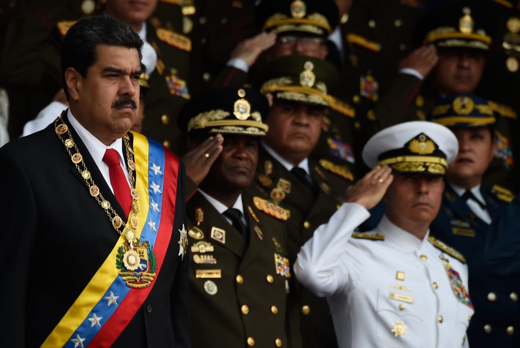 Venezuelan President Nicolas Maduro, left, survived an “attack” during a ceremony to celebrate the 81st anniversary of the National Guard in Caracas on Saturday. Venezuelan President Nicolas Maduro, left, survived an