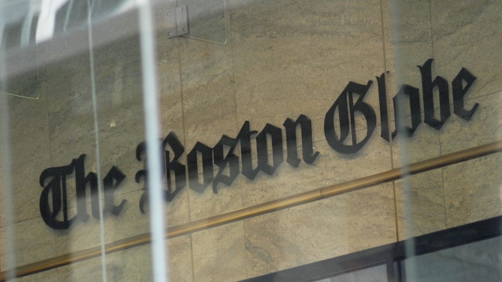 The Boston Globe’s logo as seen through the windows across from the new location of the Globe in Boston. The paper’s editors coordinated a campaign defending a free press in editorials. The Boston Globe's logo as seen through the windows across from the new location of the Globe in Boston. The paper's editors coordinated a campaign defending a free press in editorials.