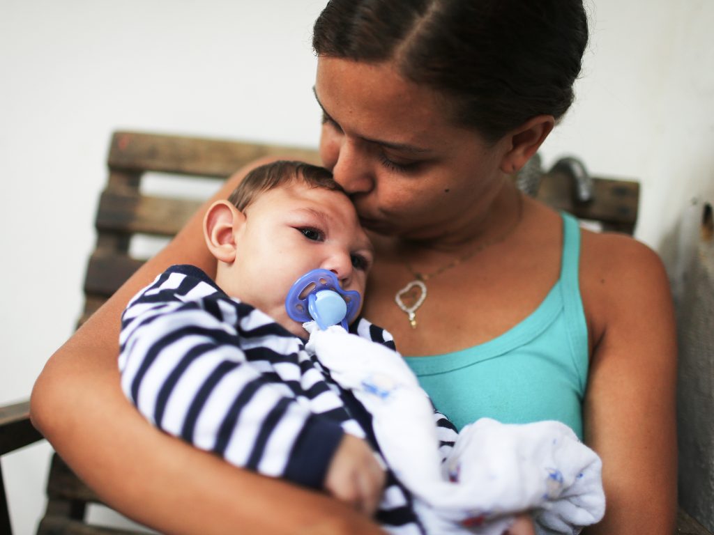 Mother Daniele Santos holds her baby Juan Pedro, who has microcephaly, on May 30, 2016 in Recife, Brazil. Researchers are now learning that Zika's effects can appear up to a year after birth.
(Mario Tama/Getty Images)