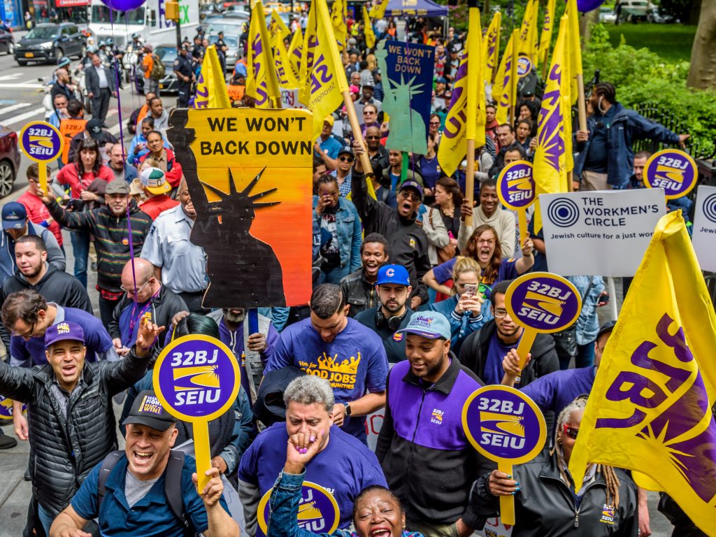 Cashiers, cooks, delivery people, fast-food workers and their supporters rallied outside New York City Hall in 2017. Their influential union, the Service Employees International Union, also includes about half a million home health aides. Cashiers, cooks, delivery people, fast-food workers and their supporters rallied outside New York City Hall in 2017. Their influential union, the Service Employees International Union, also includes about half a million home health aides. (Pacific Press/LightRocket/Getty Images)