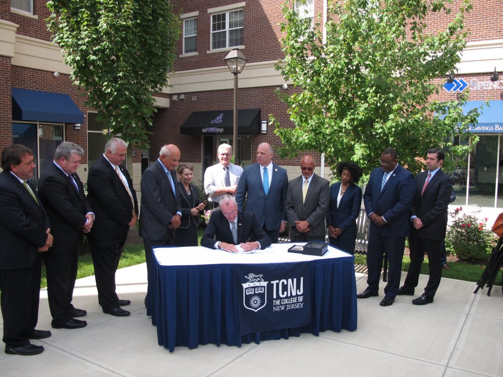 partnersign Governor Phil Murphy signs the new law at the College of New Jersey (Phil Gregory/WHYY News)