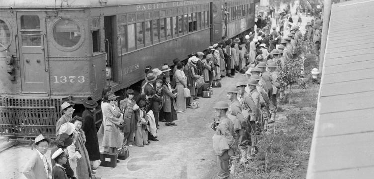persons-of-japanese-ancestry-arrive-at-the-assembly-center-located-at-the-santa-anita-racetrack-in-arcadia-california-in-1942-national-archives-and-records-administration.0.30.1200.574.752.360.c People of Japanese ancestry arrive at the assembly center at Santa Anita Racetrack in Arcadia, Calif., in 1942 for internment. (National Archives and Records Administration)