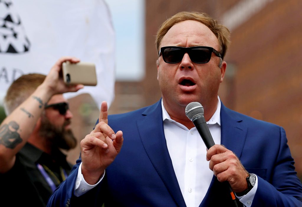 Alex Jones, shown here at a July 2016 rally in support of then-candidate Donald Trump, says he is being subjected to a “purge” from big tech companies. Alex Jones, shown here at a July 2016 rally in support of then-candidate Donald Trump, says he is being subjected to a
